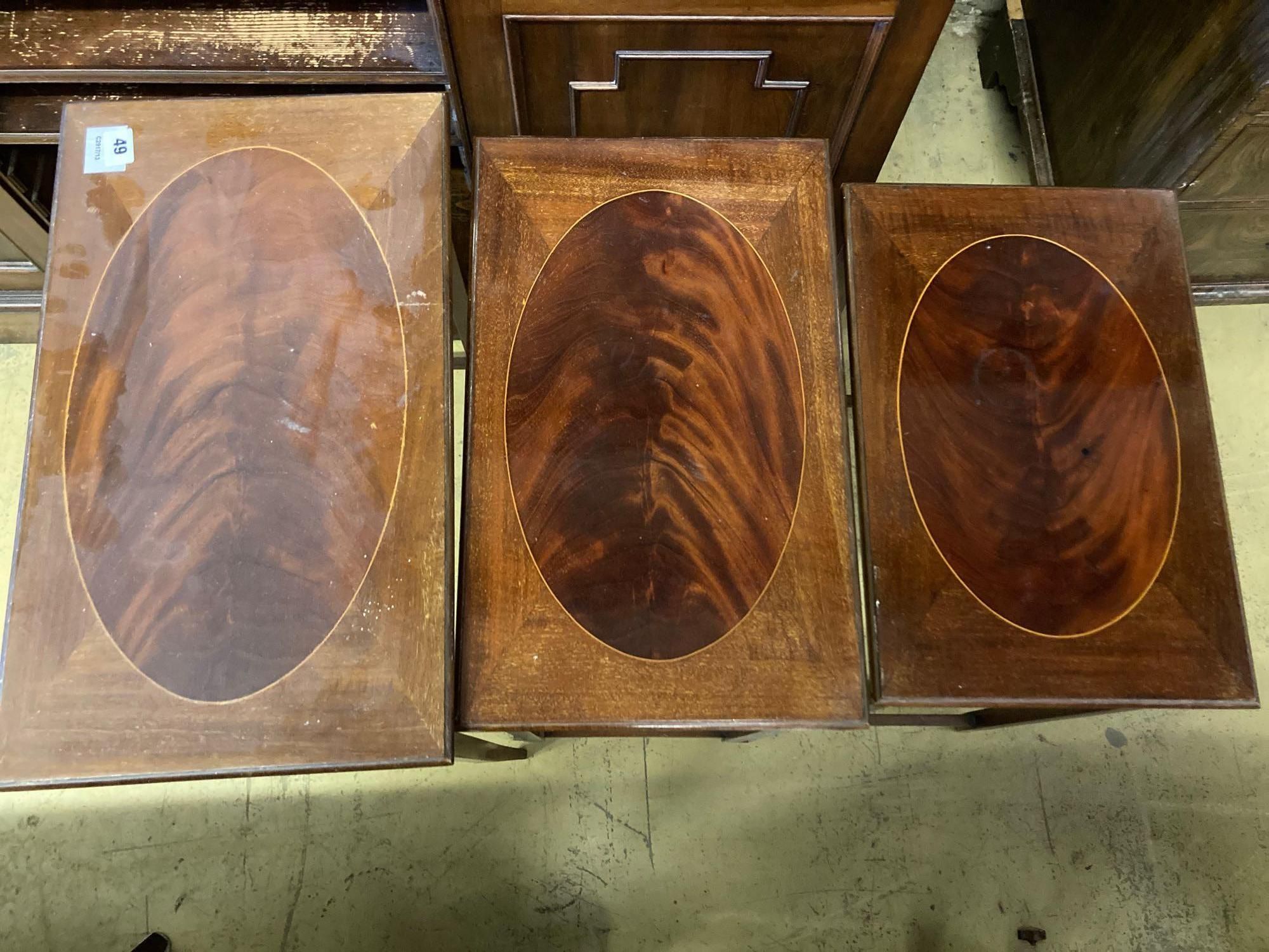 A nest of three Edwardian inlaid mahogany occasional tables, width 54cm